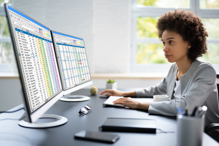 Medical Coding Spreadsheet On PC. African Woman